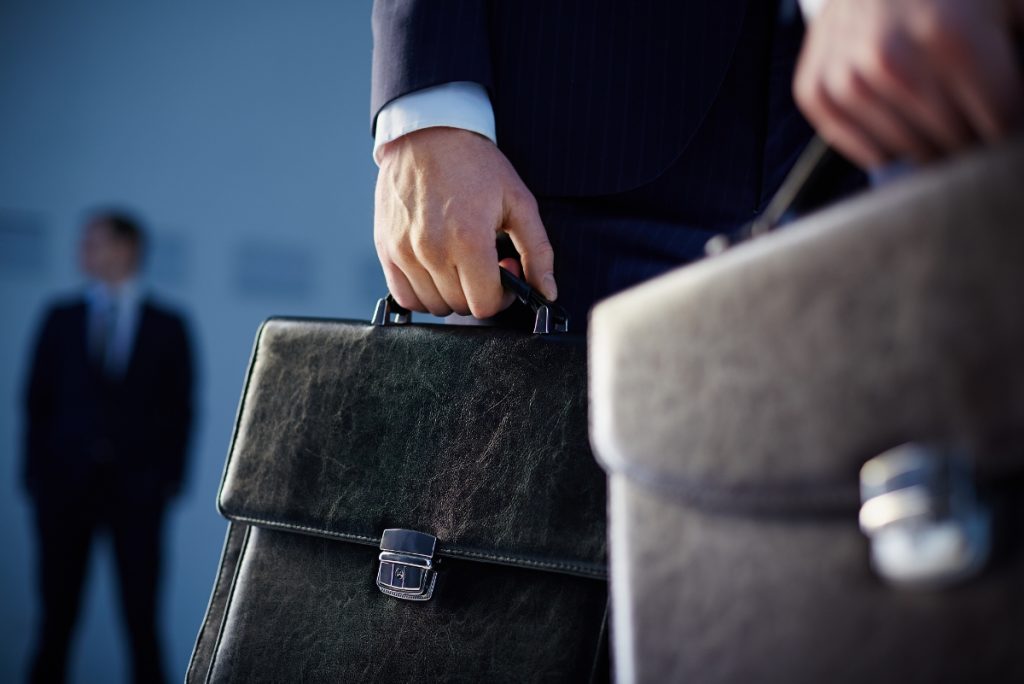 Employee with suitcase